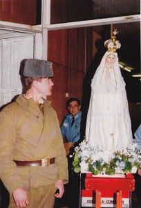 A Russian soldier studies the International Pilgrim Virgin Statue at Moscow Airport during the 1992 Peace Flight.